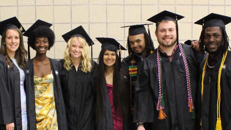 Smiling diverse group of TRIO students at graduation